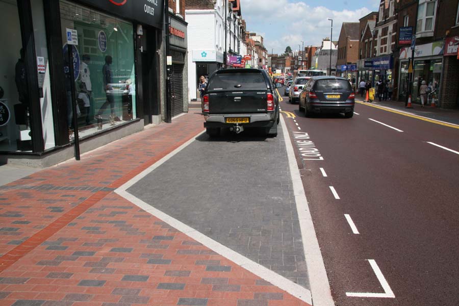 a mix of staffs pavers with plain blue loading bays in Tonbridge